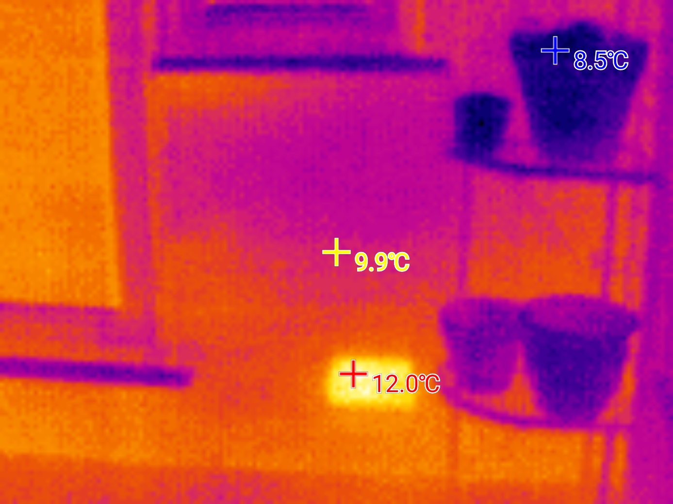 Thermal image of an external brick wall showing a hot spot in the air brick